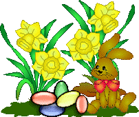Easter bunny with colored eggs on a field of flowers